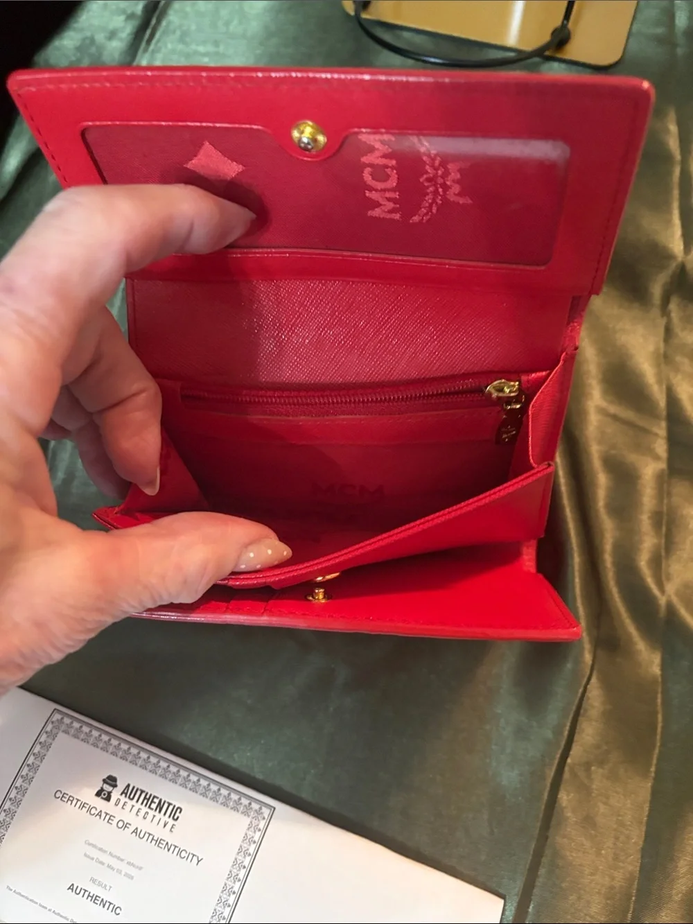 MCM Red Embossed Leather Trifold Wallet with Gold Plaque Accent